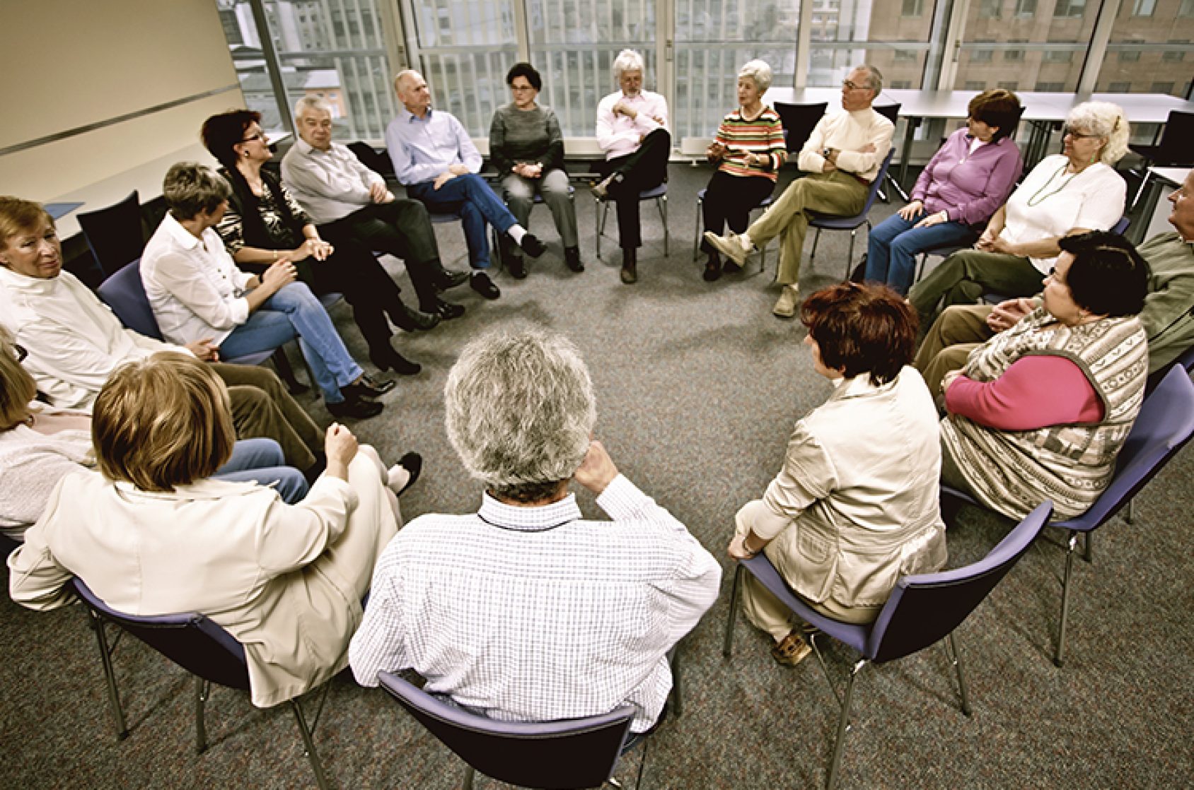 A group of people talking in a circle.